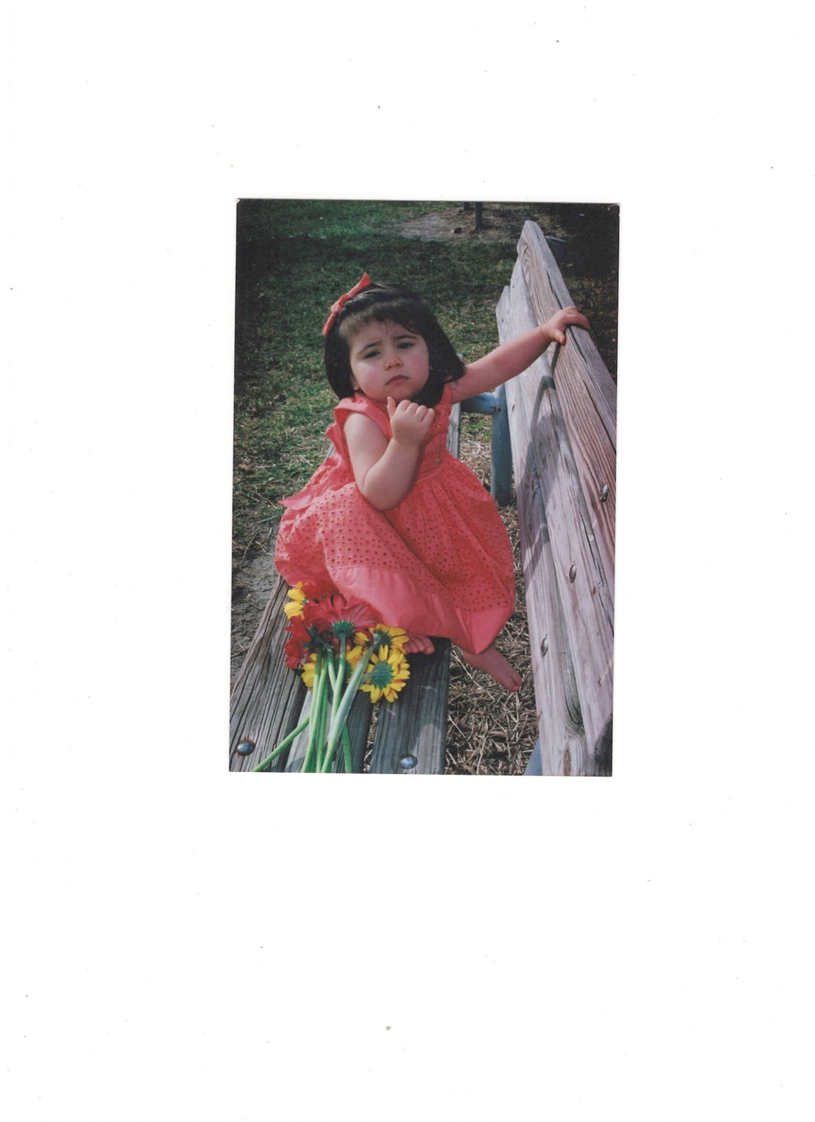 Sofia as a toddler with sunflowers