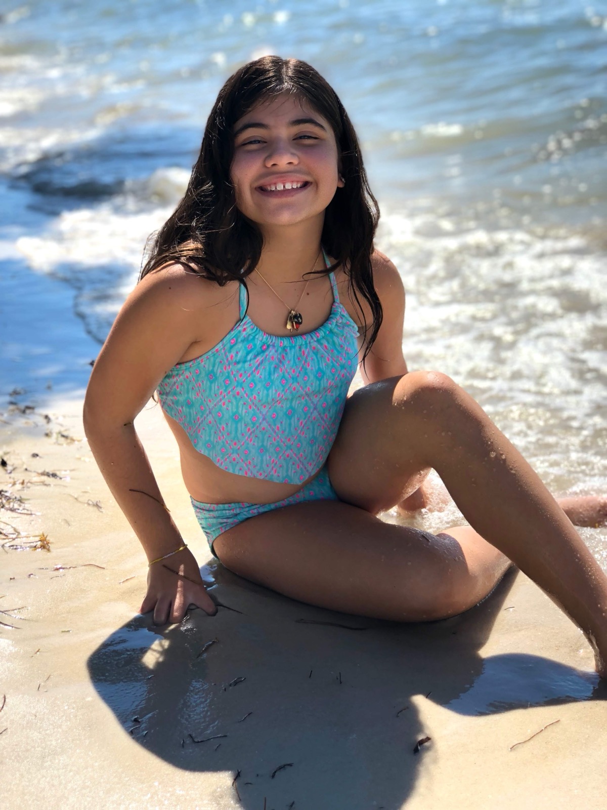 Sofia smiling at the beach